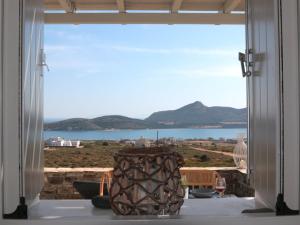 a large window with a view of the water at Bonatsa House in Agios Georgios