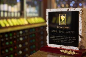 a box of wine valley valley gallery sits on a table at The Gardens Hotel in Key West