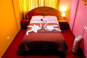 Cama ou camas em um quarto em Hostal Virgen de Las Nieves II