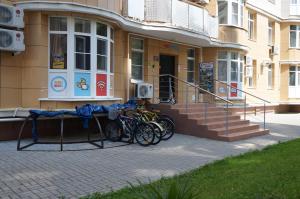 a group of bikes parked outside of a building at Hostel SunKiss in Adler