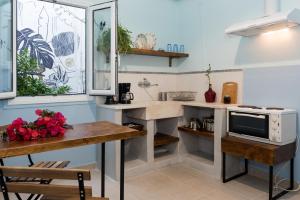A kitchen or kitchenette at Kalamata Art Rooms
