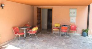a group of chairs and tables in a room at Guesthouse Stari Grad in Mostar