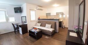 a living room with a couch and a table at Guesthouse Stari Grad in Mostar