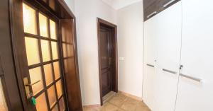 a room with a door and a hallway with a door at Guesthouse Stari Grad in Mostar