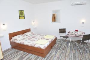 Postel nebo postele na pokoji v ubytování Apartments Neda