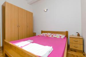 Postel nebo postele na pokoji v ubytování Apartments Ivo