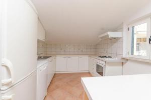 Kuchyň nebo kuchyňský kout v ubytování Apartments Ivo