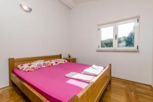 Postel nebo postele na pokoji v ubytování Apartments Ivo