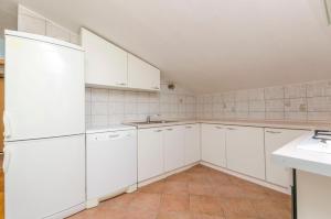 Kuchyň nebo kuchyňský kout v ubytování Apartments Ivo