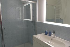 a bathroom with a shower and a sink and a mirror at Caselita in Palermo +25 photos