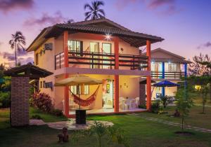 a villa with a view of a house at Chales Maragogi in Maragogi