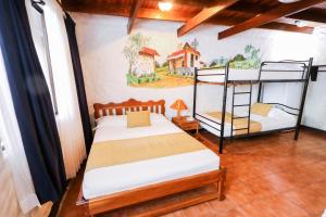 Postel nebo postele na pokoji v ubytování Hotel Flor Blanca + 37 fotografií