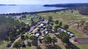 an aerial view of a park next to the water at Discovery Parks - Eden in Eden