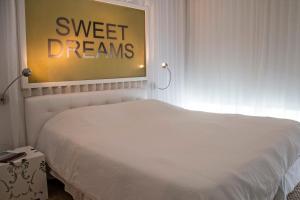 Cama ou camas em um quarto em Yoo Punta del Este - Rental Club Apartments
