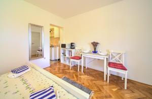 Postel nebo postele na pokoji v ubytování Apartments Rose