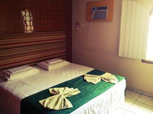 Postel nebo postele na pokoji v ubytování Cosmopolitan Hostel