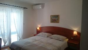 Posteľ alebo postele v izbe v ubytovaní Guest House Violeta