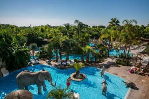 an elephant in the middle of a pool at a resort at La Marina Resort in La Marina