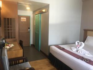 Postel nebo postele na pokoji v ubytování D-ONE Hotel