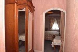 Postel nebo postele na pokoji v ubytování Hotel du Commerce