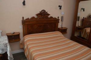 Postel nebo postele na pokoji v ubytování Hotel du Commerce