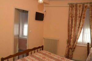 Postel nebo postele na pokoji v ubytování Hotel du Commerce