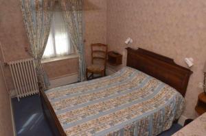 Postel nebo postele na pokoji v ubytování Hotel du Commerce