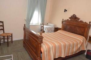 Postel nebo postele na pokoji v ubytování Hotel du Commerce