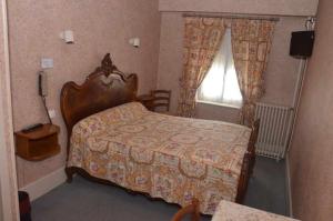 Postel nebo postele na pokoji v ubytování Hotel du Commerce
