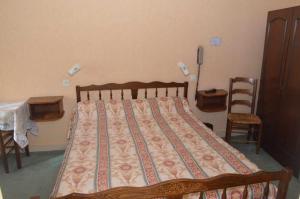 Postel nebo postele na pokoji v ubytování Hotel du Commerce