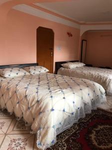 Postel nebo postele na pokoji v ubytování Hotel Payal