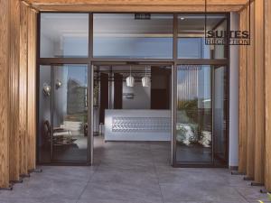 an entrance to a building with sliding glass doors at Hotel St.John Suites Adults Only in Tsilivi