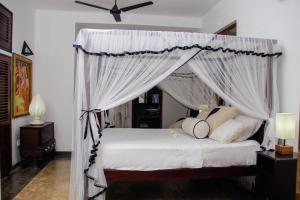 Кровать или кровати в номере Good Karma Villa