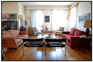 a living room with a couch and a table and chairs at Elegant Stone Mansion in Historic Mystras in Mystras