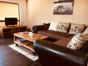 A television and/or entertainment centre at Grand Spa Holiday Home