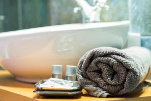 a towel on a bathroom counter next to a sink at EDEN RENTALS Duplex Adeje Palace in Playa Paraiso +42 photos