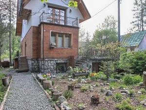 a house with a garden in front of it at Oremusówka in Zakopane