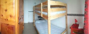 a bedroom with two bunk beds in a room at Albergo Ristorante Pizzeria Bellavista in Carenno