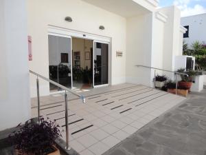 Facaden eller indgangen til Casa Cariño