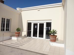 Facaden eller indgangen til Casa Cariño