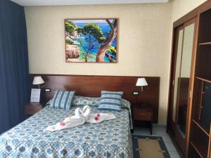 Postel nebo postele na pokoji v ubytování Grand Hotel L'Approdo