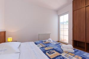 Postel nebo postele na pokoji v ubytování Apartments Isabela Punat by El-Pi Tours