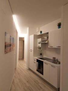 A kitchen or kitchenette at Appartamenti FronteMare