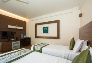 מיטה או מיטות בחדר ב-Corporate Stay