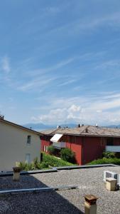 a group of buildings in a parking lot at Cabà Holiday Bardolino Gritti in Bardolino