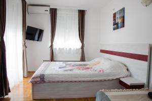 A bed or beds in a room at Apartmani Banja SPA