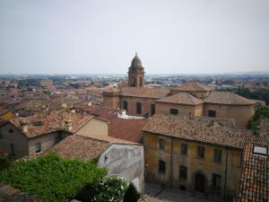 a view of a city with a clock tower and roofs at Cabà Holiday Bardolino Gritti in Bardolino