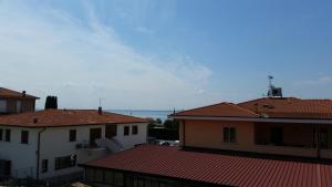 a view of roofs of buildings in a city at Cabà Holiday Bardolino Gritti in Bardolino