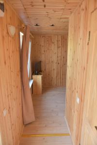 a room with wooden walls and a wooden floor at Djuna Majori in Jūrmala +44 photos