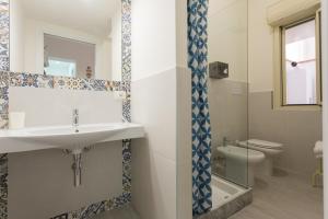 a bathroom with a sink and a toilet at dallo Zio Tot&ograve; in Palermo